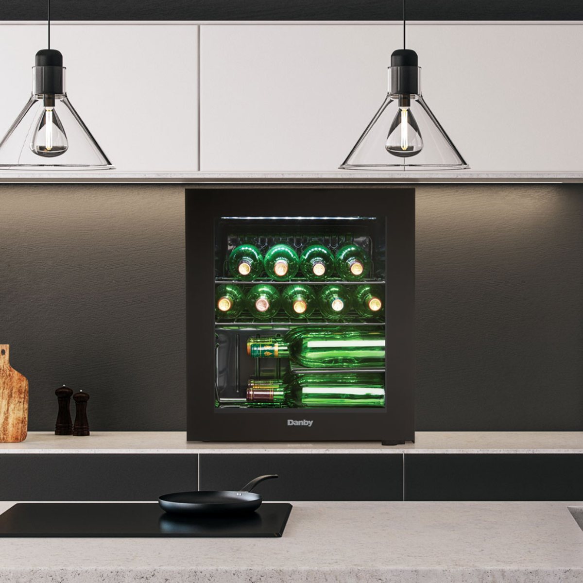 Danby 16 Bottle Freestanding Wine Cooler in Black - built into a modern kitchen island under pendant lights