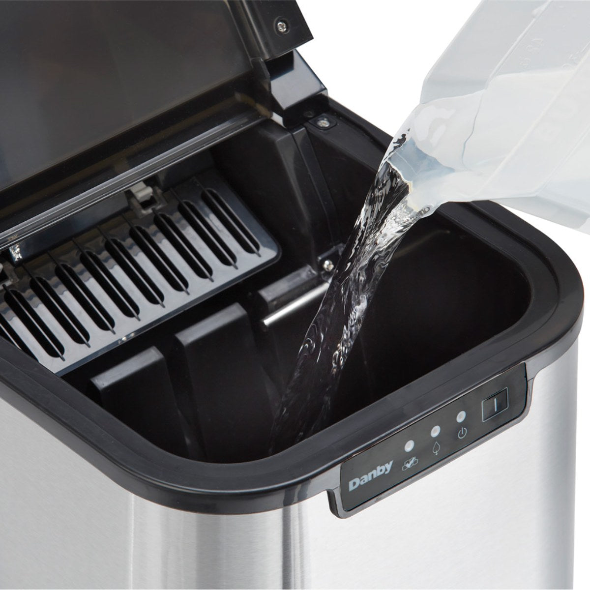 Danby 25 lbs. Countertop Ice Maker in Stainless Steel - Water being poured into ice maker