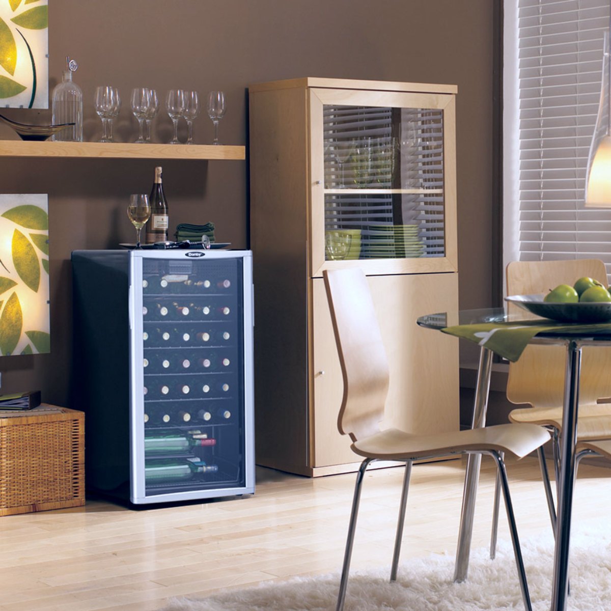 Danby 36 Bottle Freestanding Wine Cooler in Platinum - cooler in a cozy dining room with wooden furniture and glassware