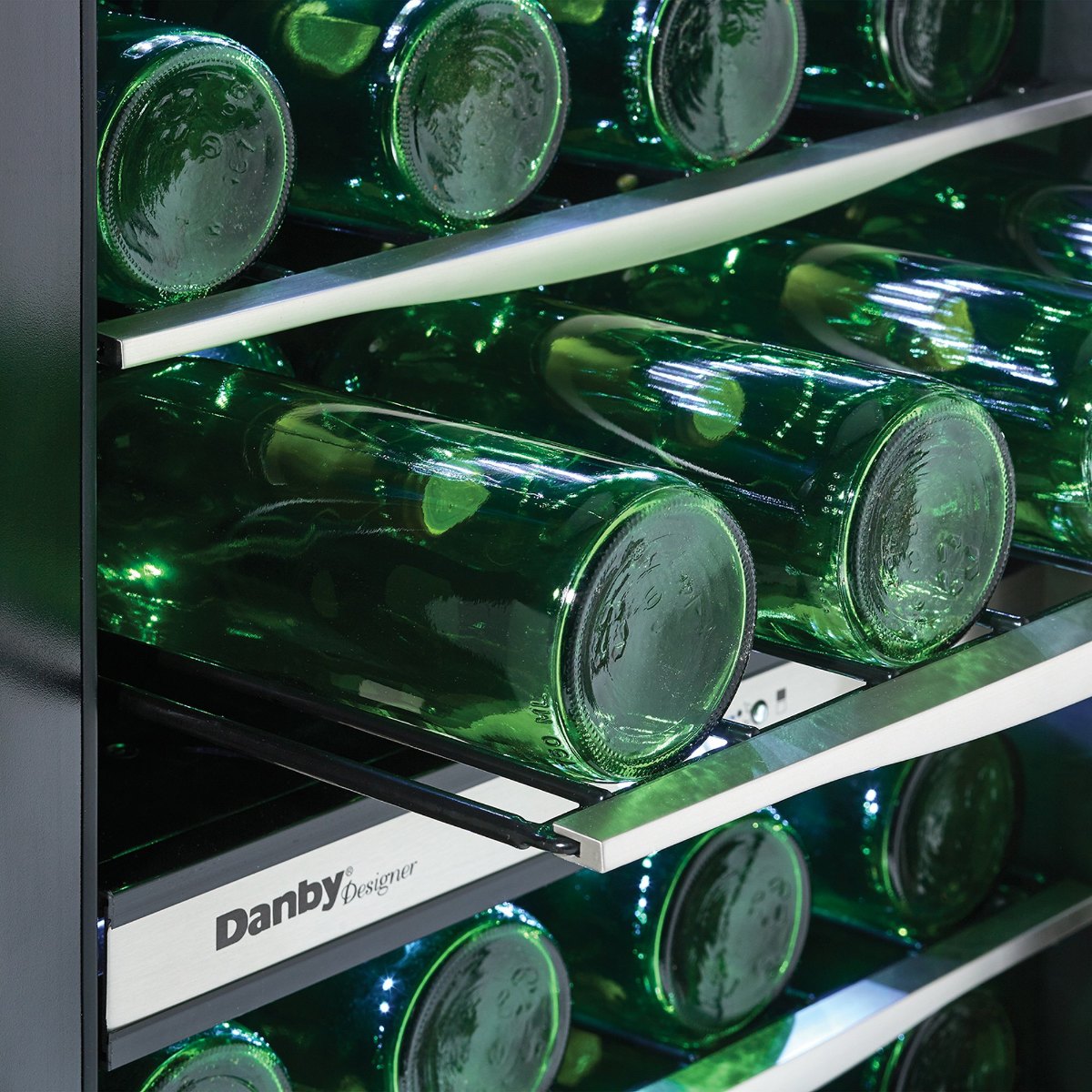 Danby 38 Bottle Free-Standing Wine Cooler in Stainless Steel - Close-up of green wine bottles on metal shelves inside