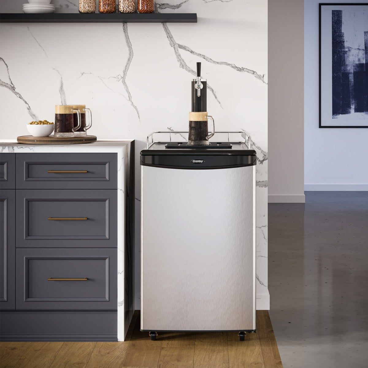 Danby 5.4 cu. ft. Single Tap Kegerator - beside gray cabinetry and marble backsplash