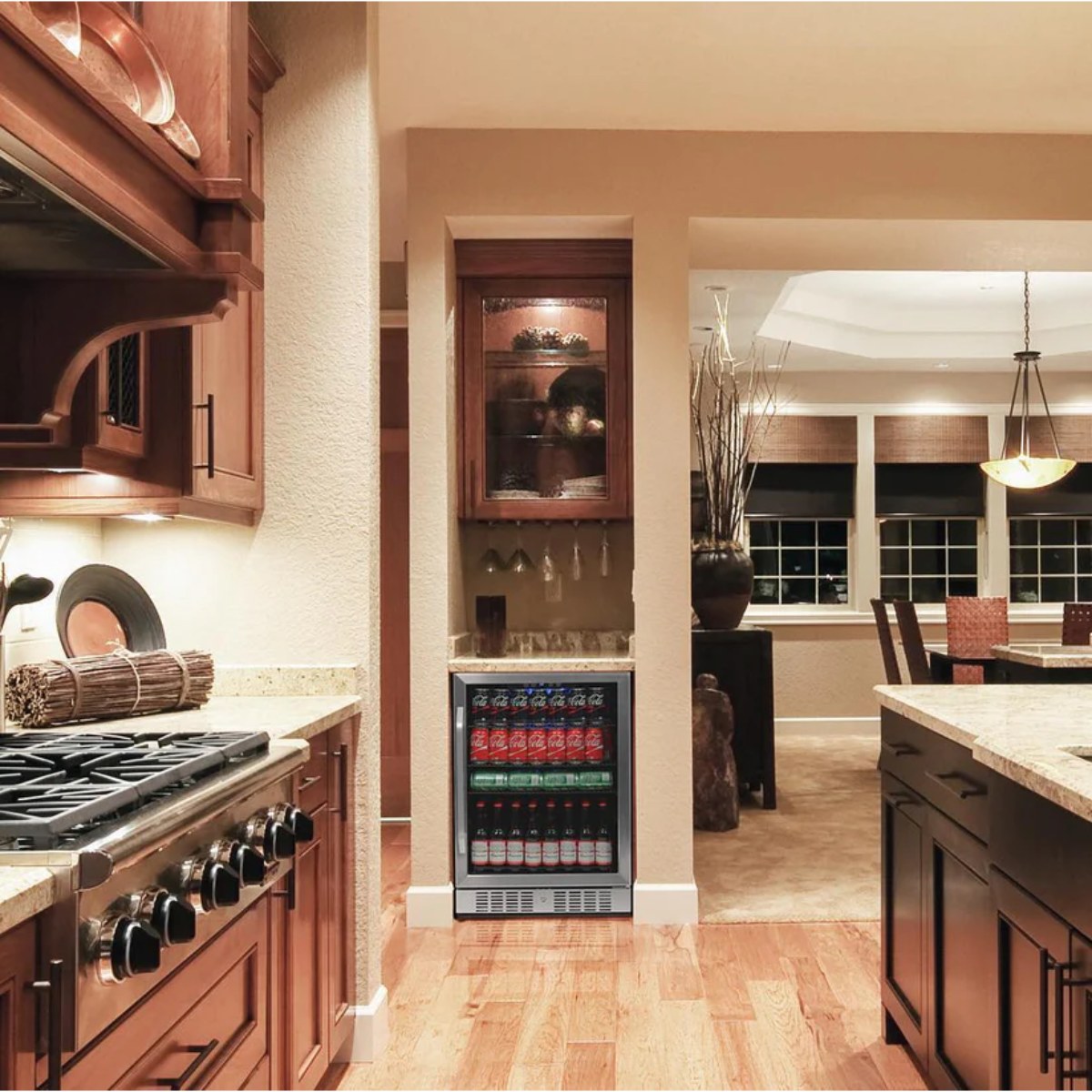 NewAir 177-Can Built-In Beverage Fridge – 24" Stainless Steel - Built-in beverage fridge stocked with drinks in a modern kitchen