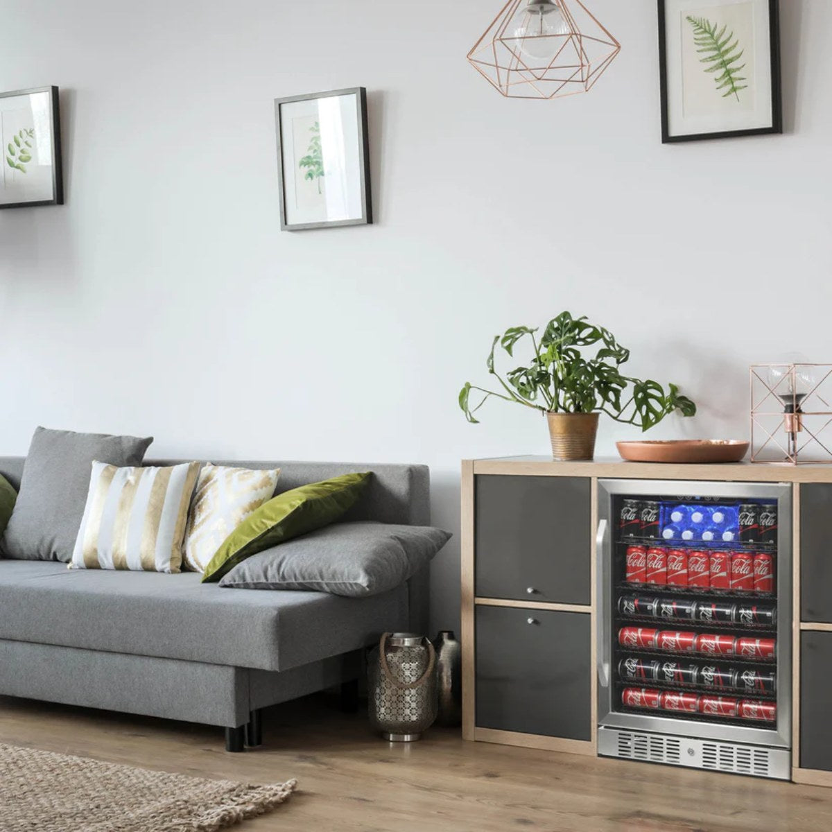 NewAir 177-Can Built-In Beverage Fridge – 24" Stainless Steel - fridge stocked with cans in a modern wood kitchen