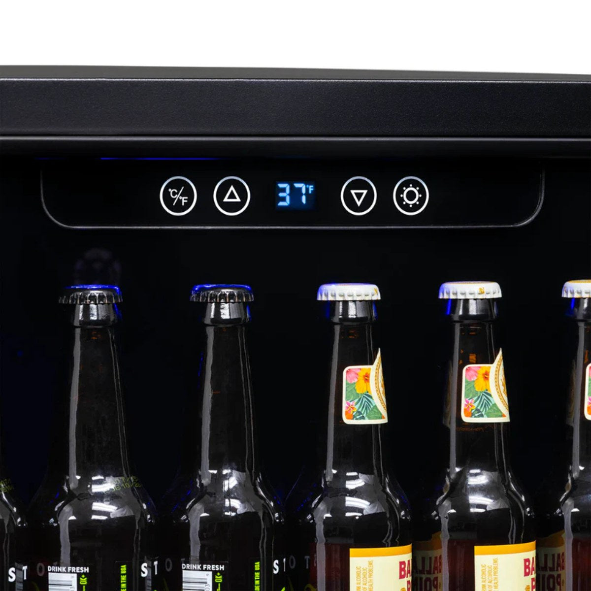 NewAir 24” Built-In 177-Can Beverage Fridge in Black Stainless Steel - Close up view of the digital thermostat with bottles of beer