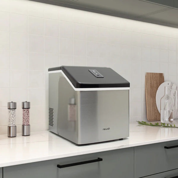 NewAir 40 lbs/Day Countertop Clear Ice Maker – Stainless Steel - ice maker on a white kitchen counter