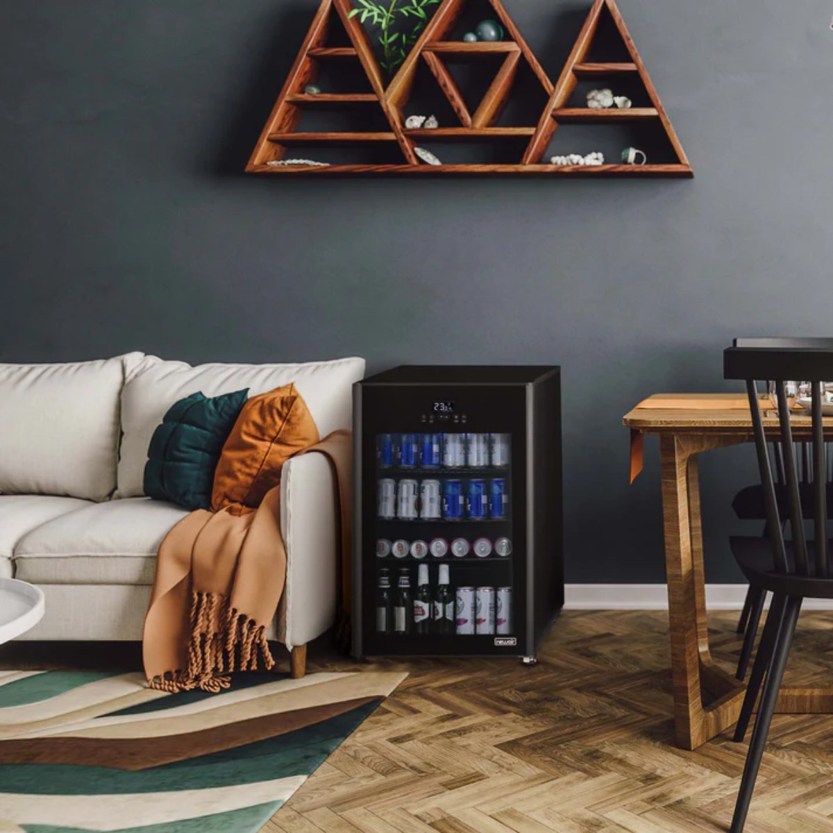 Newair 125-Can Freestanding Beer Froster – 22.1″ Black - fridge beside a sofa in a modern living room