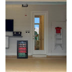 Newair 126-Can Freestanding Beverage Fridge – 19″ Black - fridge placed in a garage environment with tools, ladder, and wall storage in the background