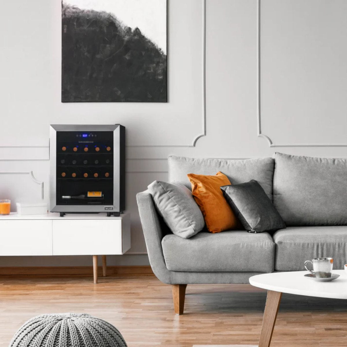 Newair 23 Bottle Freestanding Wine Fridge – 18.9" Stainless Steel - Fridge shown in the living room beside the couch