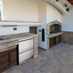 Newair 24″ 80-Can / 20-Bottle Dual Drawer Beverage Fridge - stainless steel drawer fridge in an outdoor kitchen setup