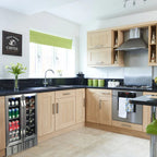 Newair 24” Dual Zone Wine and Beverage Fridge in Stainless Steel - built into a light wood kitchen