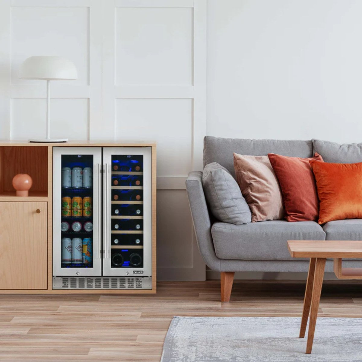 Newair 24″ SplitShelf 58-Can / 18-Bottle Dual Zone Beverage Fridge - beverage and wine fridge next to a grey sofa in a modern living room
