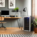 Newair 27 Bottle Freestanding Wine Fridge – 16.9" Stainless Steel - beside a home office desk with plants and decor