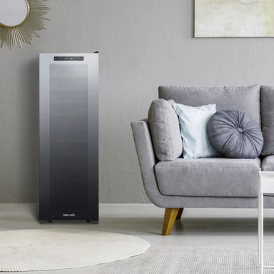 Newair 56 Bottle Shadow Series Dual Zone Wine Fridge – 16.9" Black - Fridge beside the gray couch