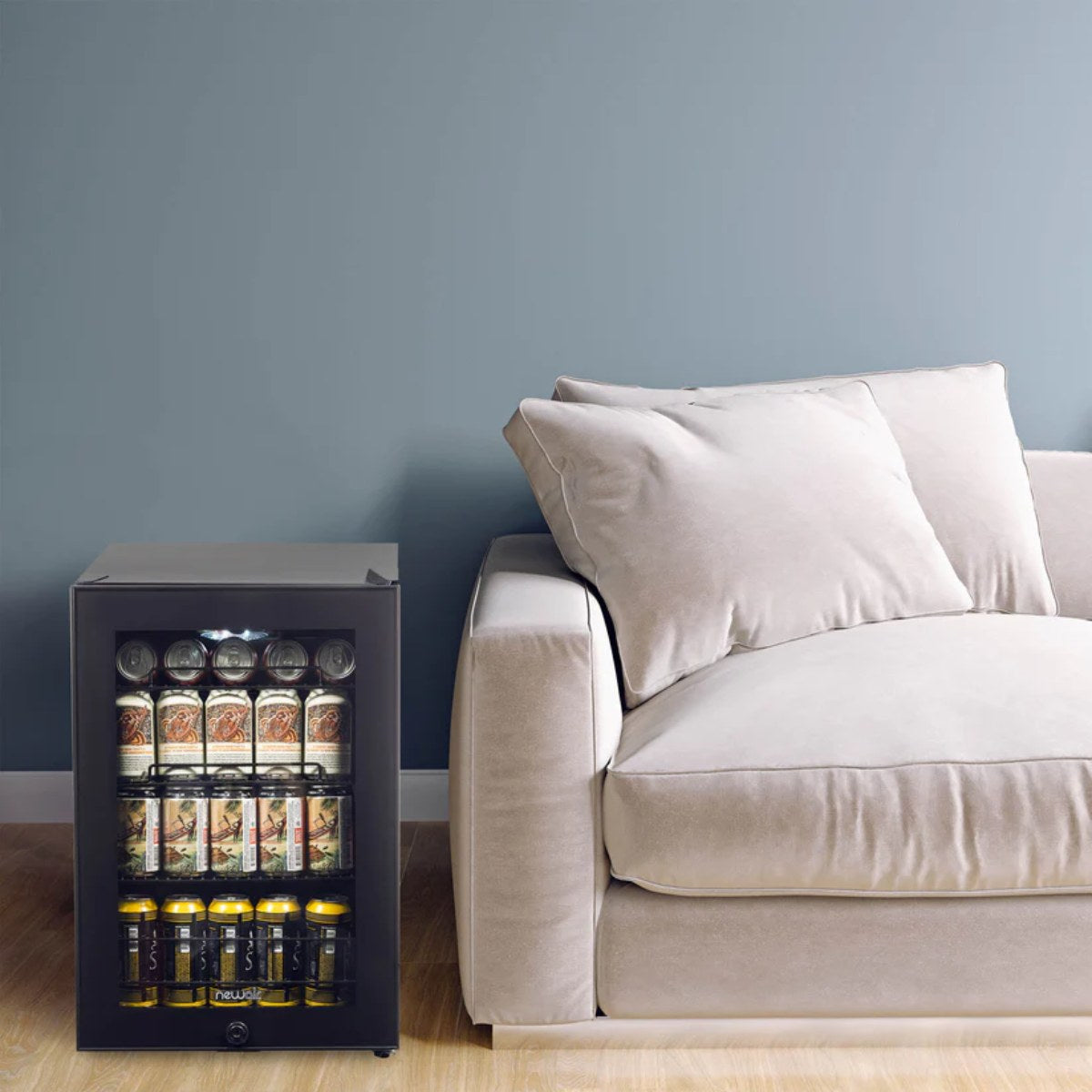 Newair 90-Can Freestanding Beverage Fridge – 17″ Black - beverage fridge beside a beige sofa in a modern living room