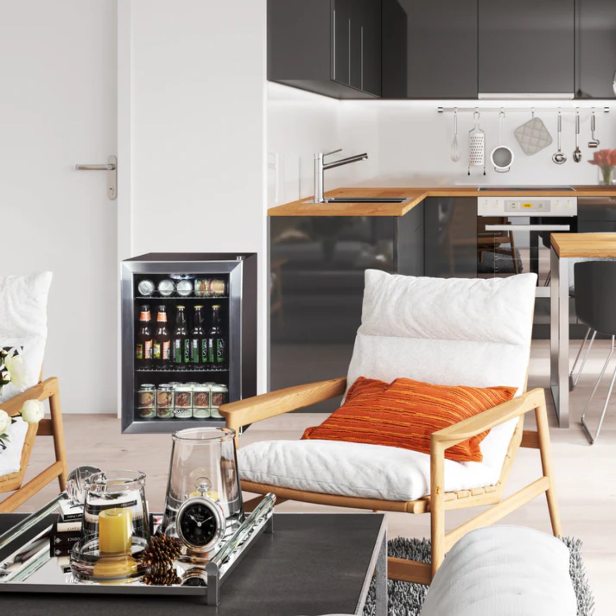 Newair 90 Can Freestanding Beverage Fridge – 17" Stainless Steel - beverage fridge in a bright modern living room beside a lounge chair
