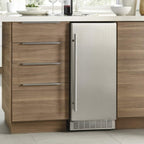 Silhouette 15″ Built-in Under Counter Ice Maker in Stainless Steel - integrated into a modern kitchen cabinet with wood finish