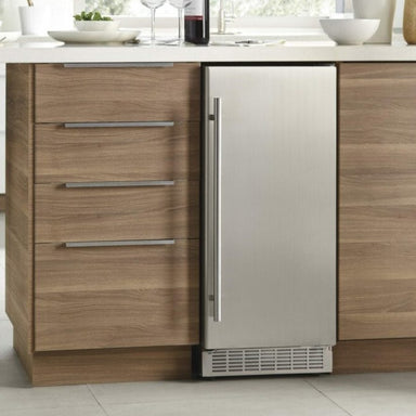 Silhouette 15″ Built-in Under Counter Ice Maker in Stainless Steel - integrated into a modern kitchen cabinet with wood finish