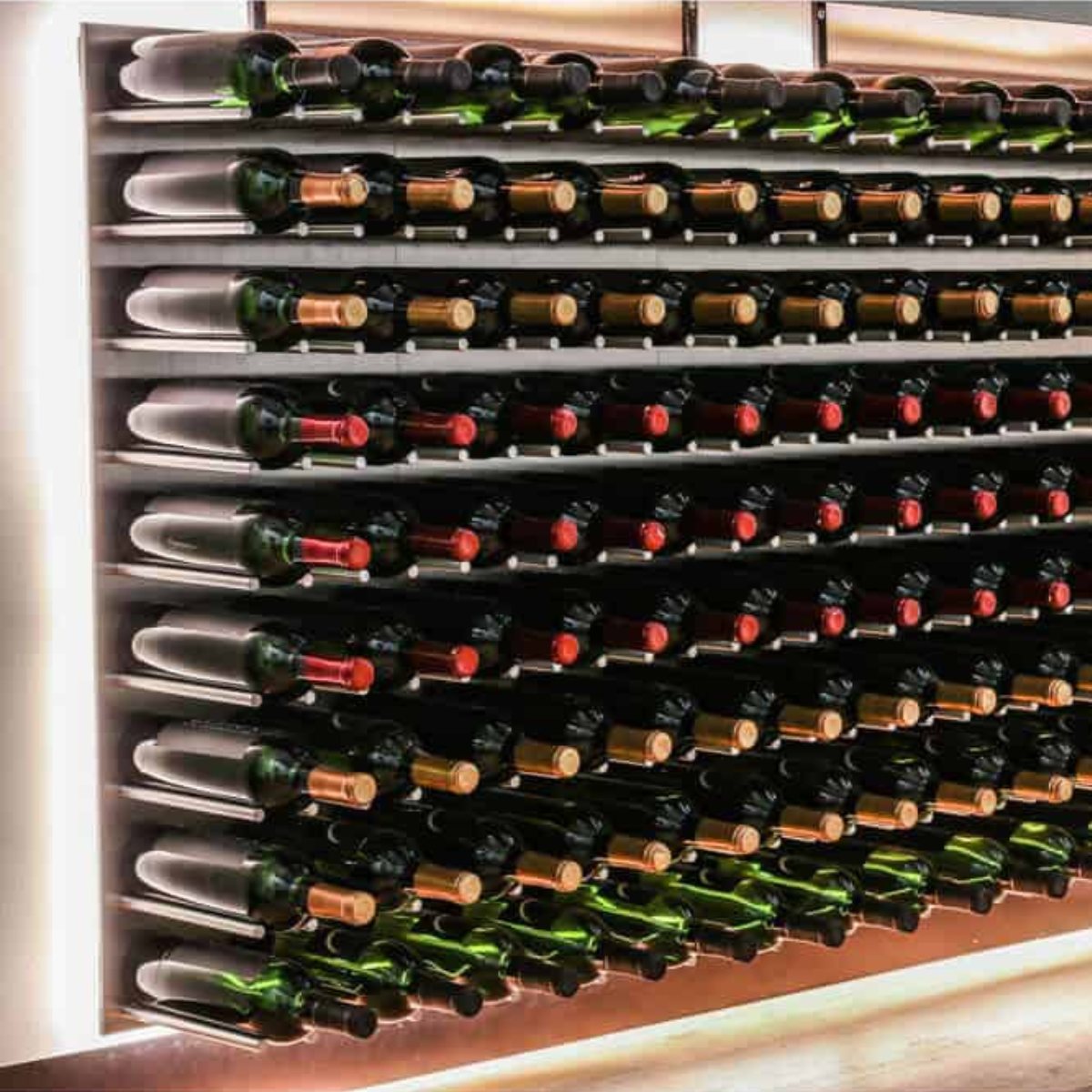 Ultra Fusion 3FT Cork-Out Wine Wall Alumasteel (27 Bottles) - Close-up of wall-mounted wine racks with bottles and LED backlighting