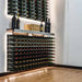 Ultra Fusion 3FT Cork-Out Wine Wall White Acrylic (27 Bottles) - Wall-mounted wine racks with backlit shelving holding rows of wine bottles and display shelf above