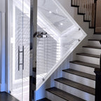 Ultra Fusion 3FT Label Out Wine Wall White Acrylic (9-27 Bottles) - Glass-enclosed wine cellar built under a staircase with wall-mounted racks