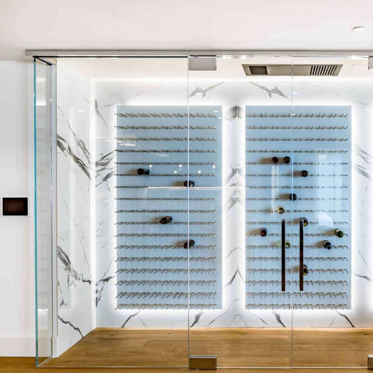 Ultra Fusion 4FT Cork-Out Wine Wall White Acrylic (36 Bottles) - Modern glass wine cellar with marble walls and backlit racks