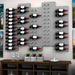 Ultra Fusion 4FT Label Out Wine Wall Alumasteel (12-36 Bottles) - Modern wall-mounted wine rack with staggered bottle display above console table