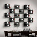 Ultra Fusion Panel Wine Rack – Black Acrylic Label-Out - Wall-mounted wine racks in a geometric grid pattern above a modern dining table
