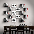 Ultra Fusion Panel Wine Rack – White Acrylic Label-Out - Wall-mounted wine racks in a geometric grid pattern above a modern dining table