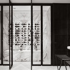 Ultra Label-Out Horizontal Wine Pegs - Glass-enclosed wine cellar with marble walls and wall-mounted bottle racks