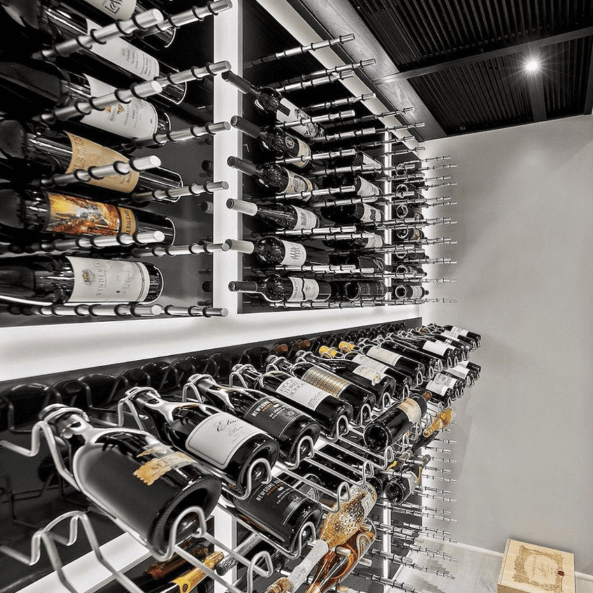 Ultra Label-Out Horizontal Wine Pegs - Modern wine cellar with wall-mounted racks and backlit bottle displays