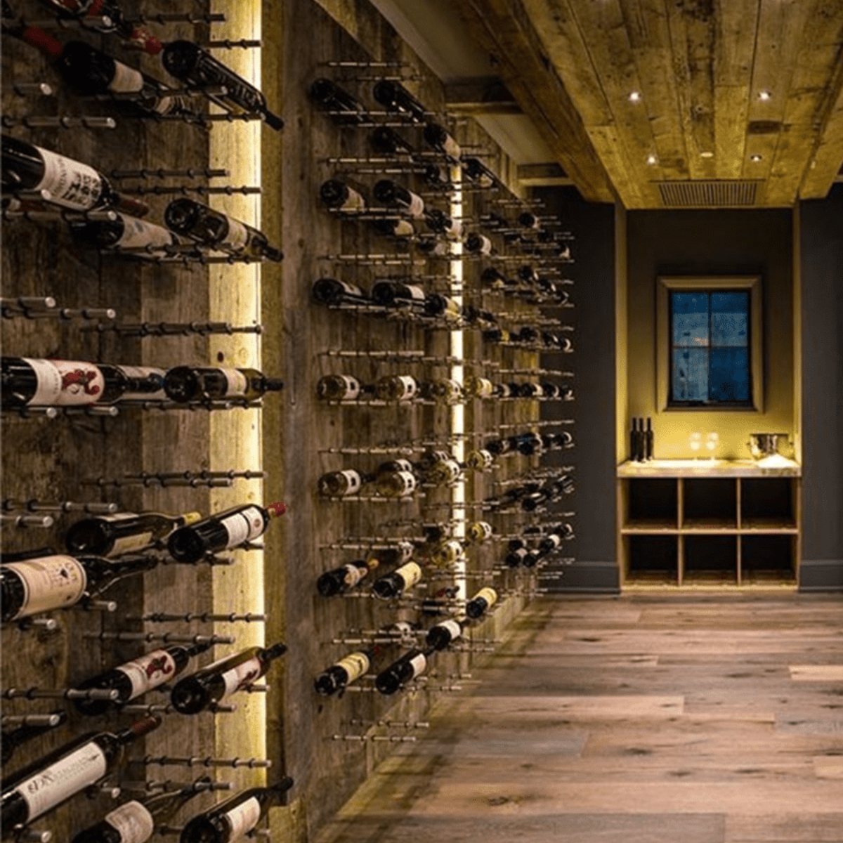 Ultra Label-Out Horizontal Wine Pegs - Rustic wine cellar with wooden ceiling, wall-mounted racks, and warm accent lighting