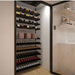 Ultra Showcase Featured Centerpiece Kit (90-100 Bottles) - Modern glass-enclosed wine cellar with black label-forward racks holding wine bottles in an organised display triple deep deep