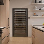 Ultra Showcase Standard Display Kit (121 Bottles) - Modern kitchen with a glass-enclosed wine storage wall featuring multiple rows of bottles