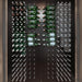 Ultra XL Cork-Out Wine Peg - Modern wall-mounted bottle display with water and sparkling beverages arranged neatly on racks