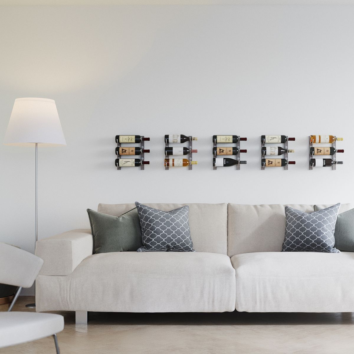 VintageView 1 Foot wall mounted wine rack installed above a sofa on a minimalist white wall with compact bottle storage