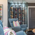 VintageView 3 Foot wall mounted wine storage rack installed inside a glass enclosure with label forward bottle display in a modern living room