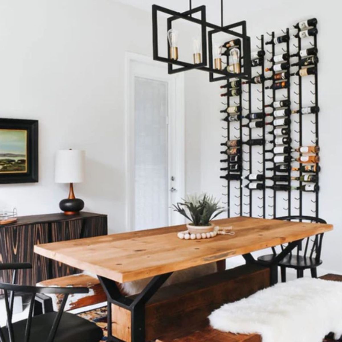 VintageView 4 Foot wall mounted wine rack installed in a modern dining room with floor to ceiling vertical wine bottle display