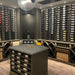 VintageView 4 Foot wall mounted wine rack installed inside a luxury wine cellar with label forward bottle storage on feature walls