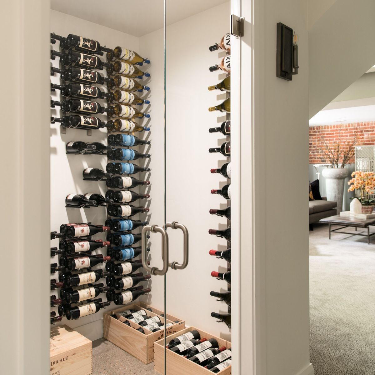 VintageView 6 Foot wall mounted wine storage rack installed inside a glass enclosed wine room with modern label forward bottle layout