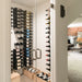 VintageView 6 Foot wall mounted wine storage rack installed inside a glass enclosed wine room with modern label forward bottle layout