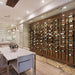 VintageView 7 Foot wall mounted wine storage rack displayed behind glass in a modern kitchen feature wall with label forward wine bottles