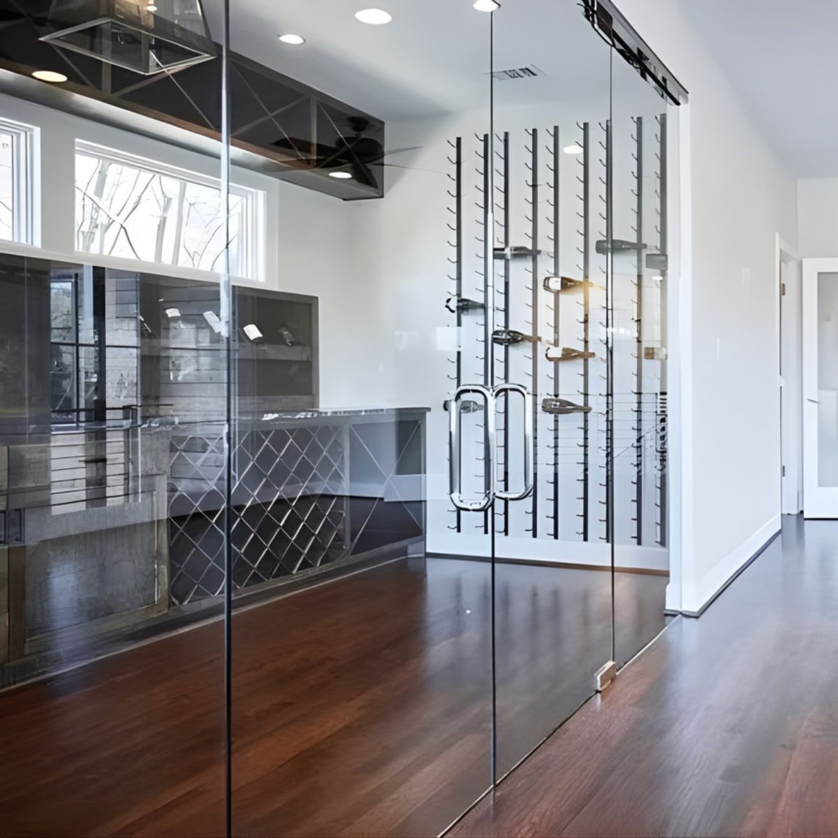 VintageView 8 Foot wall mounted wine storage rack mounted behind glass doors in a contemporary home with clean architectural lines