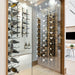 VintageView 8 Foot wall mounted wine storage rack installed inside a glass enclosed modern wine cellar with label forward bottle display
