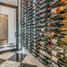 VintageView Feature Wall 7-foot wine rack installed behind glass in a temperature controlled wine cellar