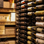 VintageView Feature Wall 7-foot wine rack installed alongside wood cellar shelving with horizontal bottle storage