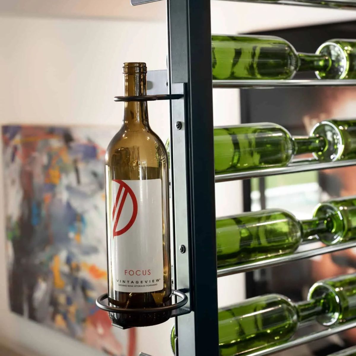 Close up of VintageView Perch 1 bottle vertical wall mounted wine rack showing label forward bottle support and steel mounting hardware