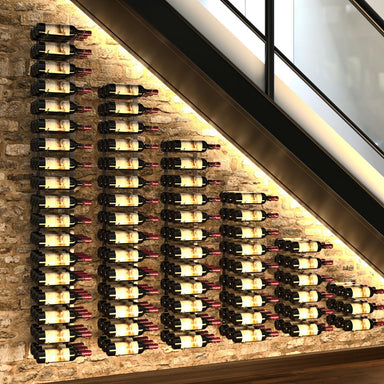 VintageView under the stairs wall mounted wine rack installed on a stone wall with multi column bottle storage