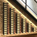 VintageView under the stairs wall mounted wine rack installed on a stone wall with multi column bottle storage