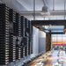VintageView wall mounted wine cellar shelf creating a dramatic wine wall in a commercial dining space with high capacity horizontal bottle display