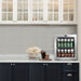 Whynter BR-062WS 68-Can Stainless Steel Beverage Refrigerator - fridge filled with soda cans on a kitchen counter beside popcorn and a drink